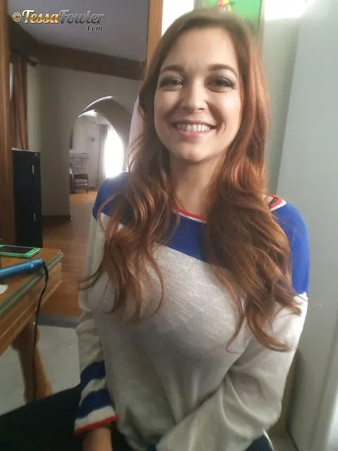 Tessa Fowler: Redhead with Big Tits Poses in a Pleated Skirt – photo 2 of 16