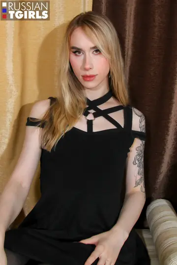 Trans Woman Stretches Arms Overhead and Poses Nude