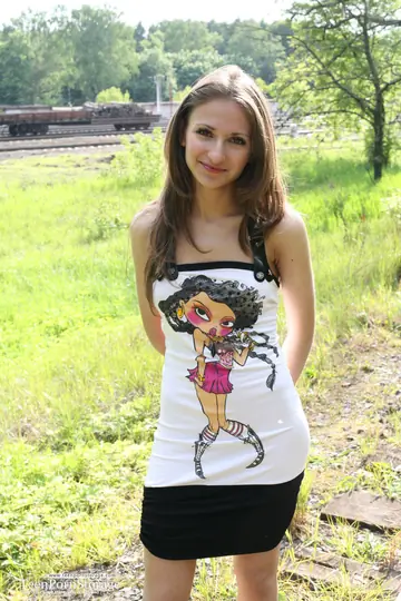 Skinny Brunette in High Heels Spreads Outdoors