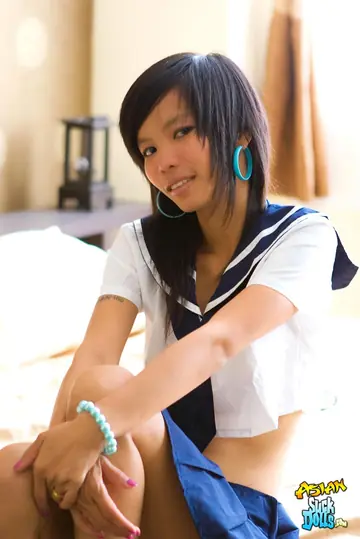 Slim Thai Strips Out of Her Uniform and Spreads