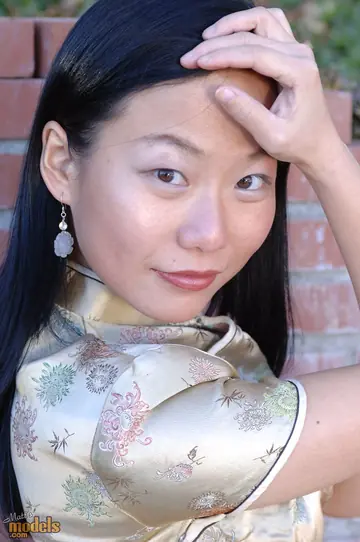 Thick Asian MILF Stands Naked Outdoors After Stripping by a Wall