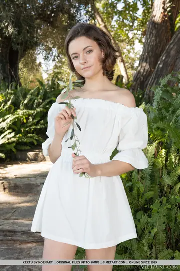 Brunette Oils Up and Spreads on a Garden Path