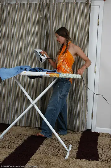 Slim Brunette in Pigtails Strips Out of Her Jeans to Show Her Hairy Pussy