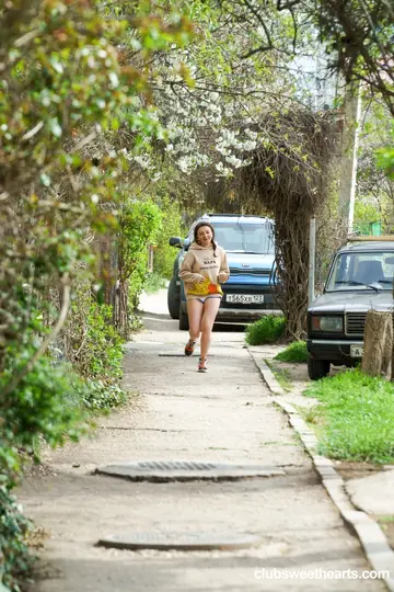 Tall European Blonde in Pigtails Rides Outdoors in Shorts