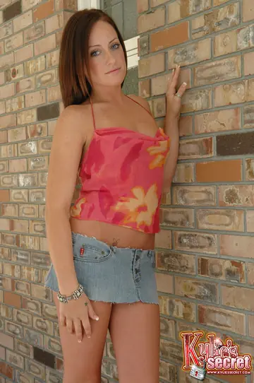 Redhead Amateur Covers Her Tits While Wearing a Skirt