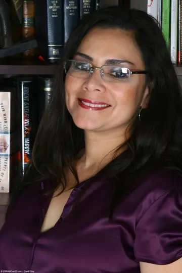 Mature Latina Undresses and Spreads Her Shaved Pussy in the Office