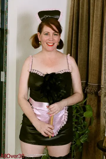 Caitlin Moore – Busty Redhead MILF Strips Off Her Maid Uniform in Stockings and Heels