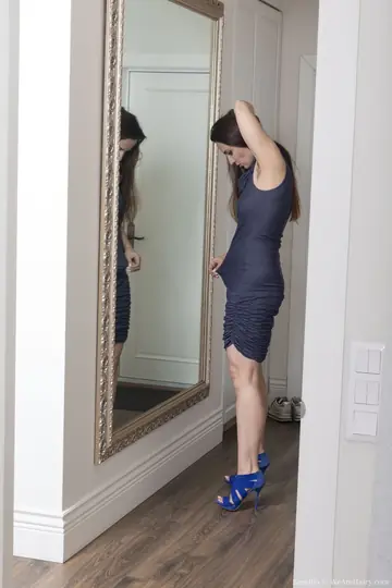 Brunette in a Dress Lifts Hem to Show Her Hairy Pussy