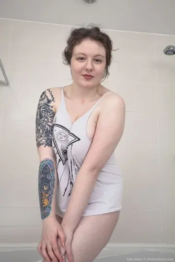 Busty Mature Brunette Spreads Her Hairy Pussy in the Bathroom