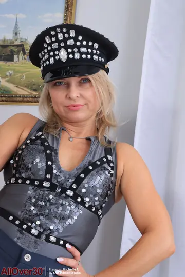 Mature Blonde MILF Strips Out of Her Costume in Heels