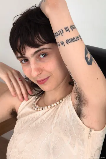 Thick Brunette Displays Her Hairy Underarms and Pussy