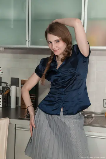 Blonde Strips Naked in the Kitchen and Spreads Her Hairy Pussy