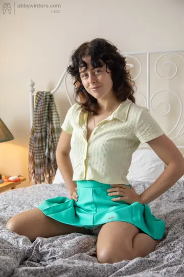 Curly Brunette Amateur Strips Off Her Panties to Show Hairy Pits and Pussy