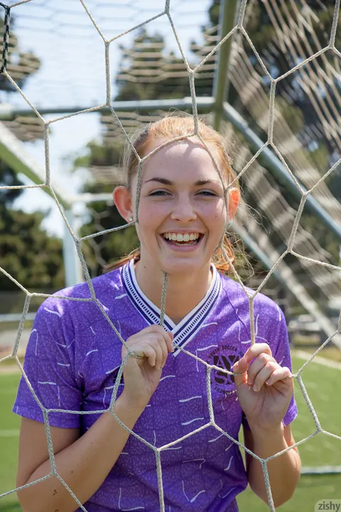Bailey Rayne: Redhead Pulls Down Her Shorts to Flash Her Ass on a Soccer Field – photo 4 of 11