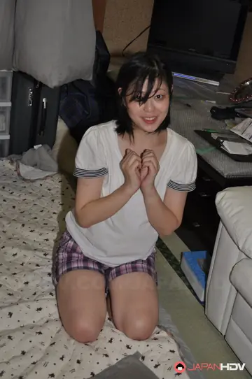 Japanese Babe with Short Hair Gives a Handjob and Spreads Her Hairy Bush