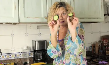 Anne Swinger – Mature European Blonde Strips and Masturbates with a Cucumber in the Kitchen