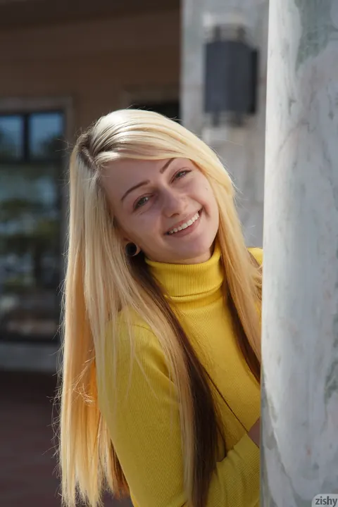 Dahlia Polk: Petite Blonde Teases Her Ass and Tits in Library While Clothed – photo 8 of 13