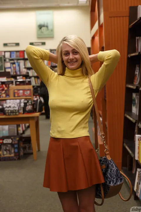 Dahlia Polk: Petite Blonde Teases Her Ass and Tits in Library While Clothed – photo 6 of 13