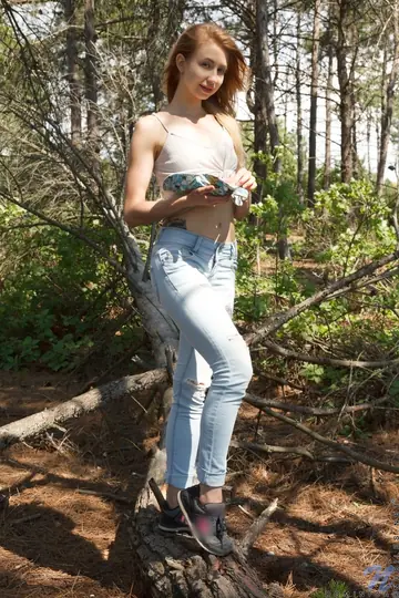 Woman Slips Jeans Down to Show Her Shaved Pussy in the Forest