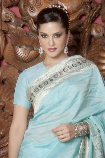 Sunny Leone – Busty Indian MILF Strips Out of Her Skirt and Heels