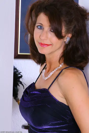 MILF with Big Tits Poses in Stockings