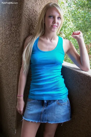 Blonde Amateur Strips Nude and Poses for the Camera
