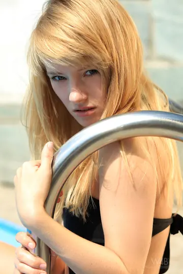 Blonde Strips Off Her Bikini and Poses on the Pool Ladder