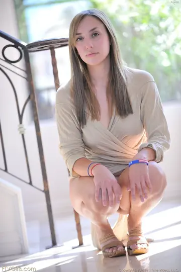 Woman Poses Nude and Strips for the Camera