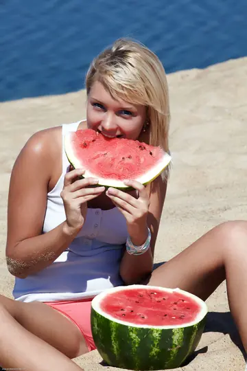 Mature Blonde Woman Spreads Her Shaved Pussy on the Beach