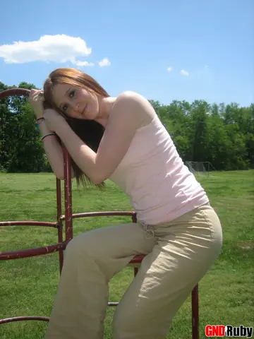 Redhead Bares Her Breasts and Spreads on Playground