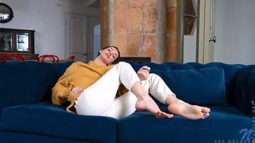 Short-Haired Brunette Opens Her Legs to Reveal Her Shaved Pussy