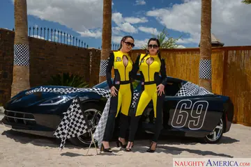 Dillion Harper – Busty Brunettes in Uniform and Heels Share a Cock on a Sports Car