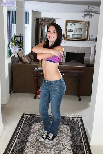 Slim Brunette Strips Out of Her Jeans and Exposes Her Pussy