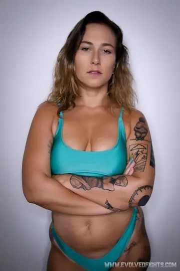 Red August – Busty Tattooed Babe Gets Fucked in Her Bikini While Wrestling