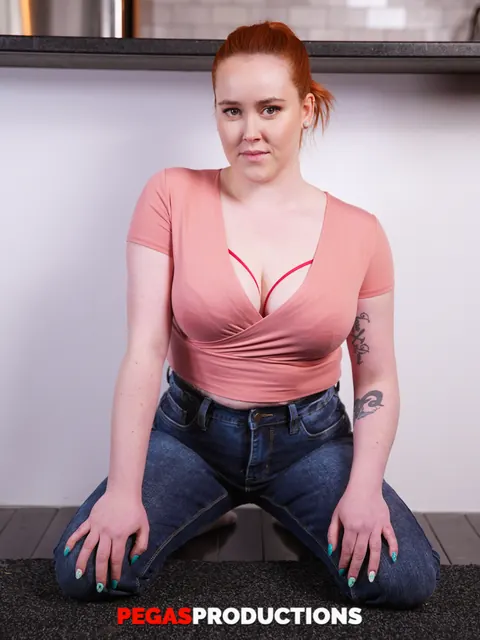 Lexa Reed: Busty Redhead Shows Cleavage in Jeans and Socks in the Kitchen – photo 9 of 13