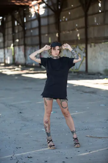 Stacy Cloud – Short-Haired Tattooed Woman Poses Nude in Public Wearing Glasses