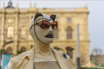 Pigtailed Woman in Latex and Heels Strolls Public Streets