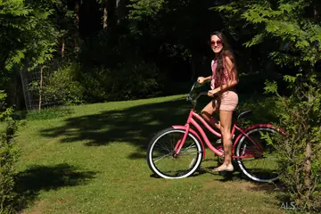 Slim Tattooed Brunette Flashes Her Shaved Pussy Outdoors in Shorts