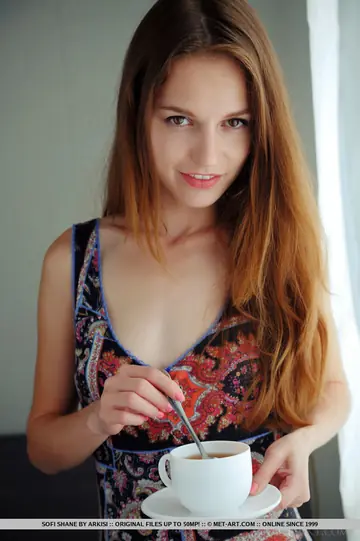 European Brunette Sips Coffee on Leather Sofa and Spreads Her Hairy Pussy