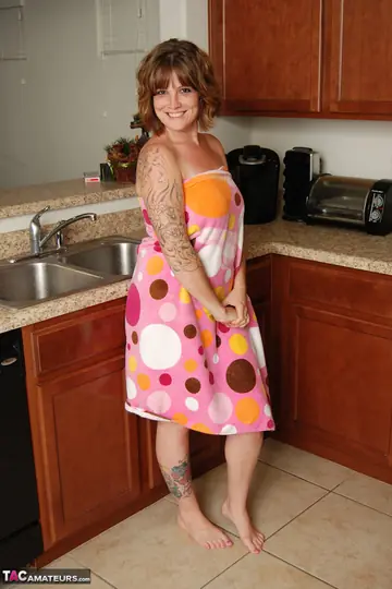 Thick Redhead MILF Undresses and Spreads in the Kitchen