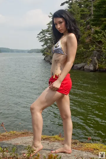 Tattooed Woman Strips Out of Her Bikini and Poses by the River