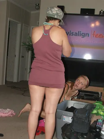 Brunette Undresses and Poses Showing Her Natural Tits