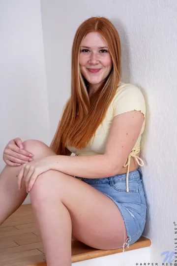 Redhead Strips Out of Her Lingerie and Spreads on the Stairs
