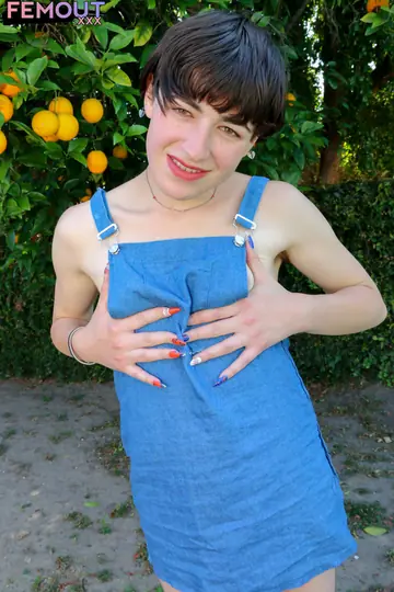 Trans Woman with Small Tits Stands Nude Outdoors in Sunlight