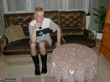 Tiffany Pearl – Mature Blonde Sheds Her Stockings and Boots on Leather Sofa