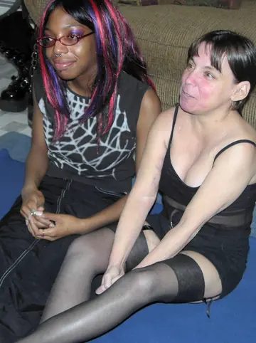 Redhead MILF and Ebony Babe Use a Banana in Lesbian Play