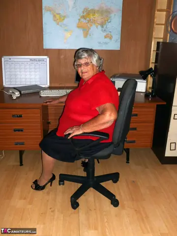 Busty British BBW Poses Nude in Heels at the Office Desk