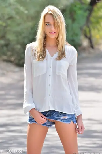 Kenna James – Tall Slim Blonde Spreads Her Legs in Shorts