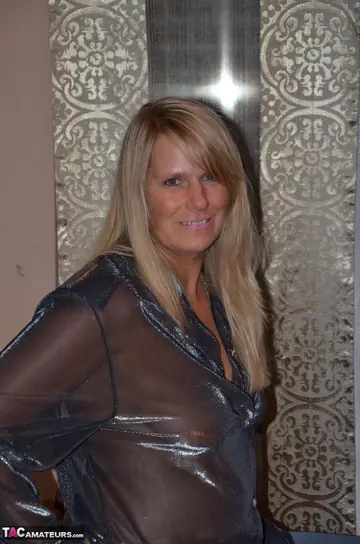 Sweet Susi – European Blonde MILF Unbuttons Her Sheer Blouse and Strips