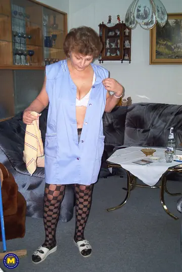 European MILF in Uniform Masturbates with a Mop Handle